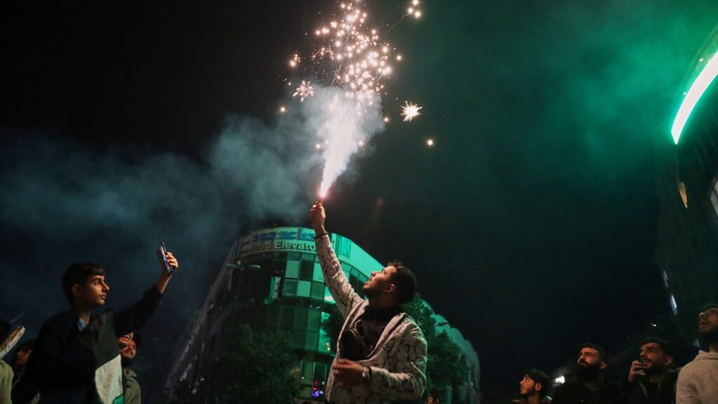 Syria celebrates U.S. lifting sanctions, year without Assad : NPR