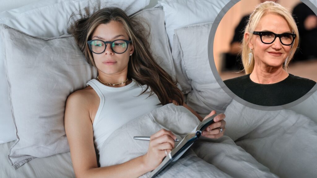 A woman with long blonde hair and black glasses wearing white vest top laying in bed with white bedding writing in a note pad, with circle inset of Mel Robbins