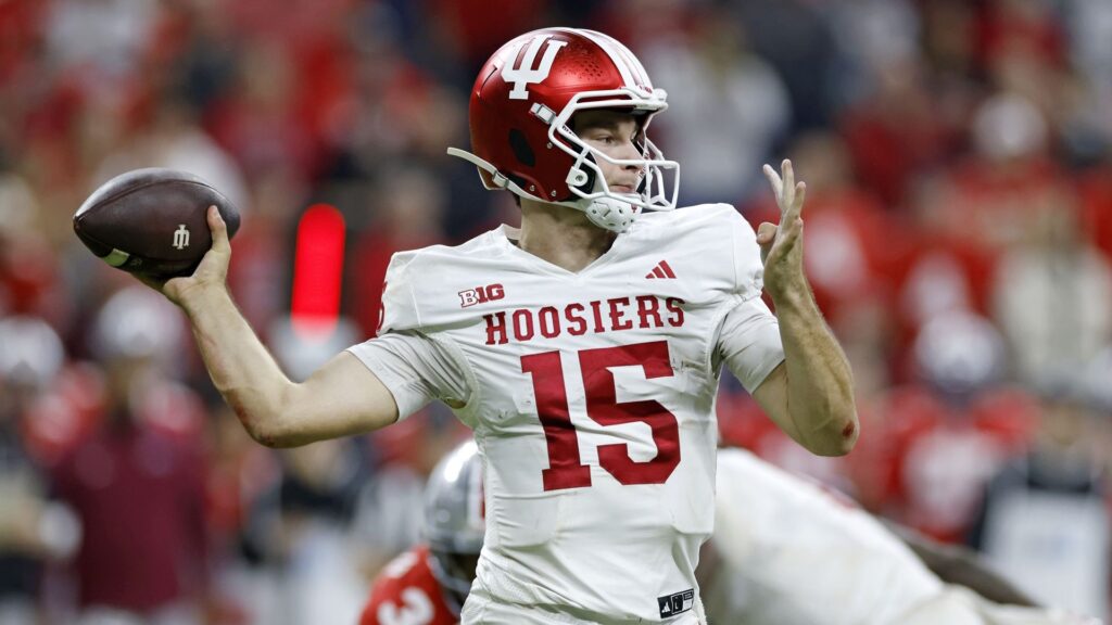 Fernando Mendoza of the Indiana Hoosiers throws a pass during a college football game.
