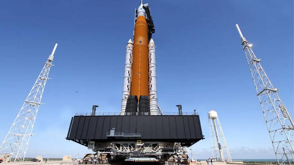 A photograph of NASA's SLS rocket system with the Orion capsule attached