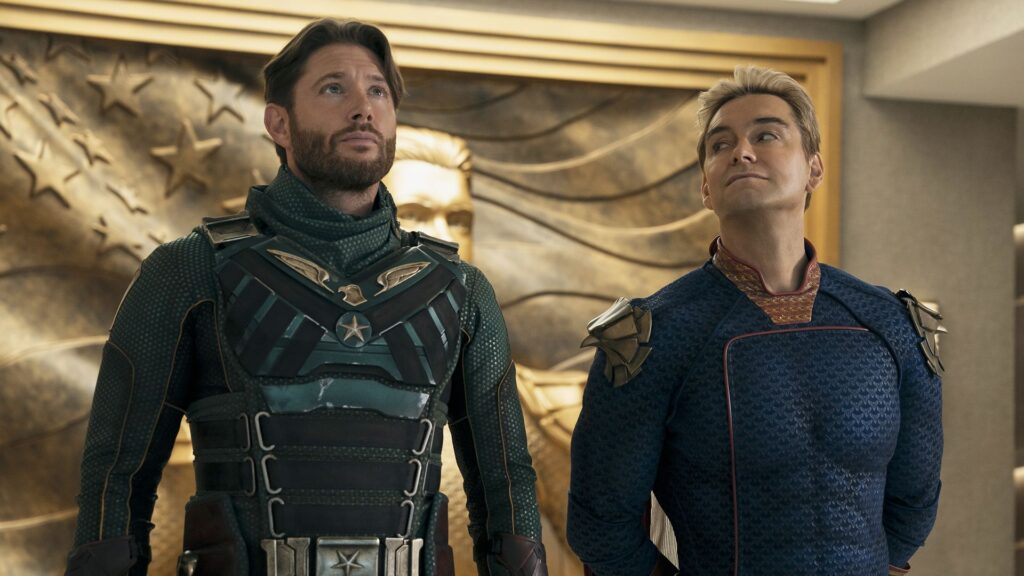 Soldier Boy looking up at something off-camera as Homelander smiles and looks at him in The Boys season 5