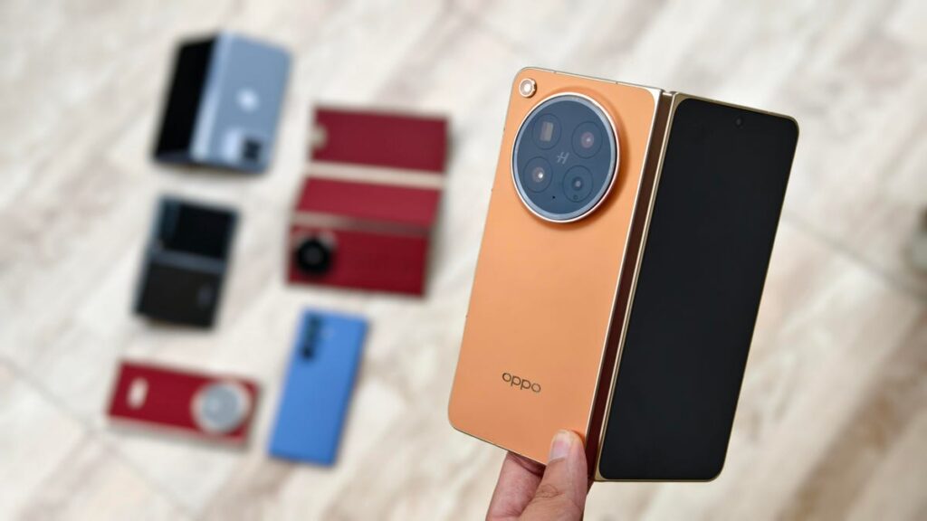 A person holding the Oppo Find N6 and Galaxy Z Fold 7.