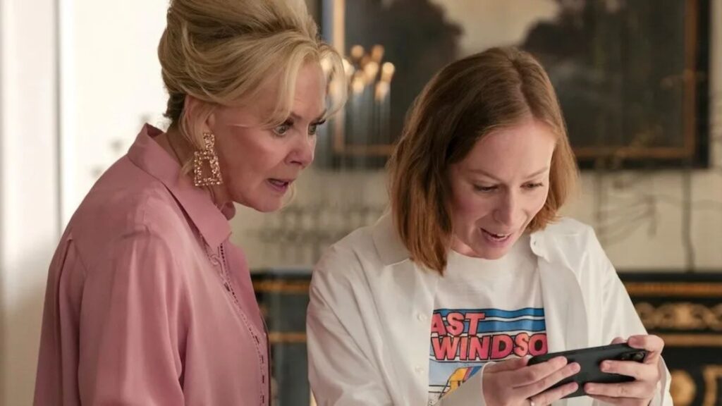Deborah looks in shock at Ava's phone