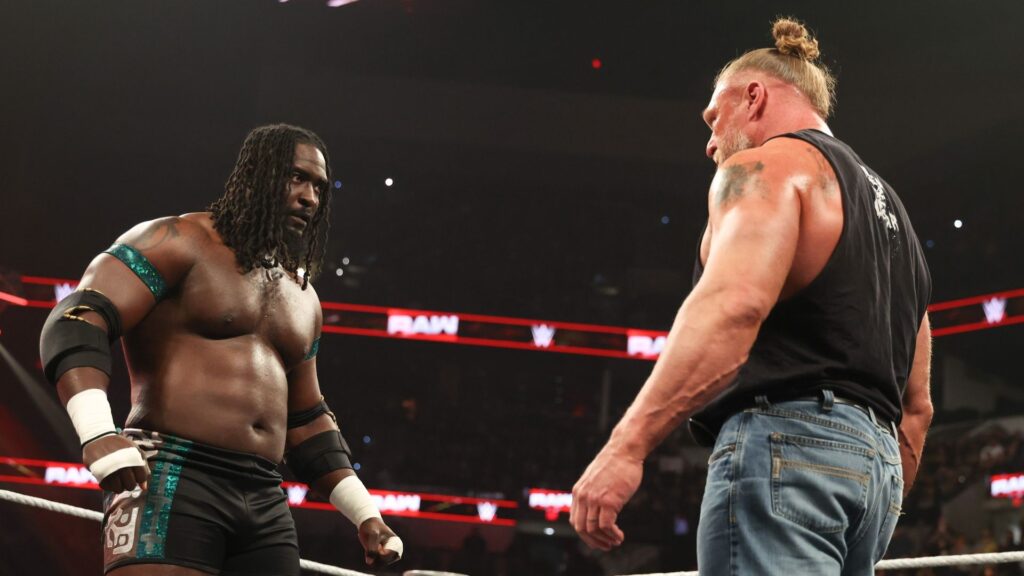 Oba Femi and Brock Lesnar facing off in ring ahead of WrestleMania 42