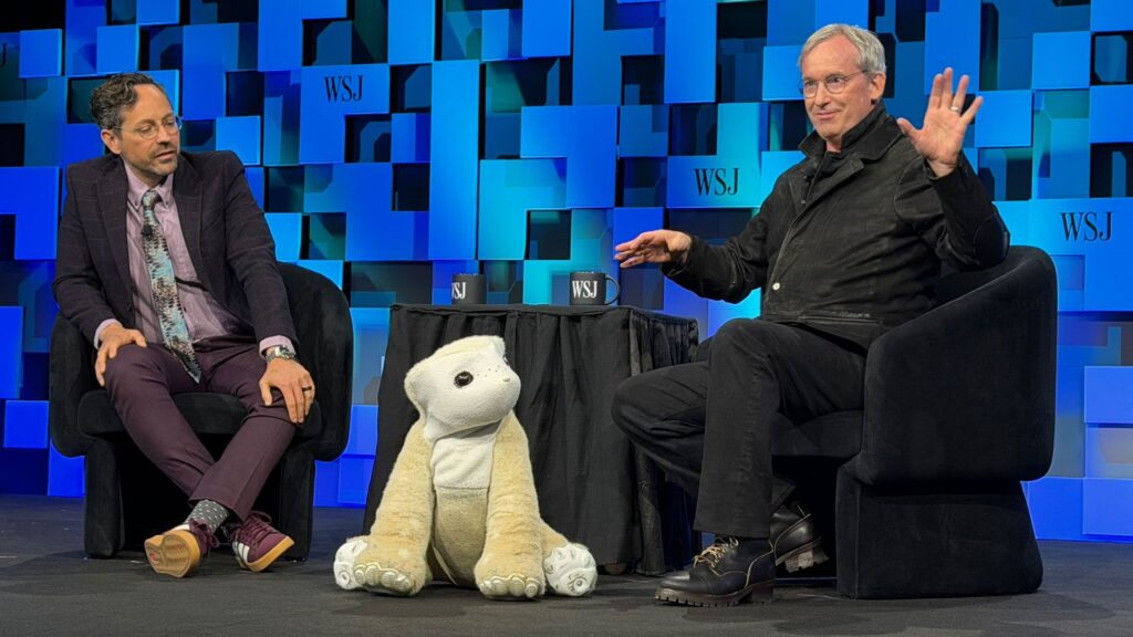 WSJ's Chris Mims on left, Daphne, the Familiar robot middle, and Familiar Machines &amp; Magic CEO Colin Angle at the Wall Street Journal Future of Everything conference on May 4.