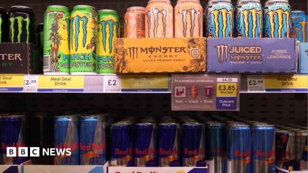 Energy drinks to be banned for under-16s in England from April Brightly coloured Monster energy drinks are displayed on a supermarket shelf above rows of Red Bull cans. Several signs show the drinks are on offer as part of a meal deal
