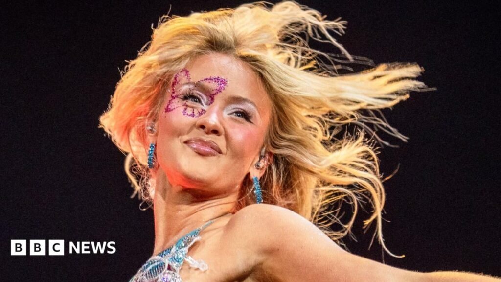 Festival-goers with glitter  and neon make-up and hair