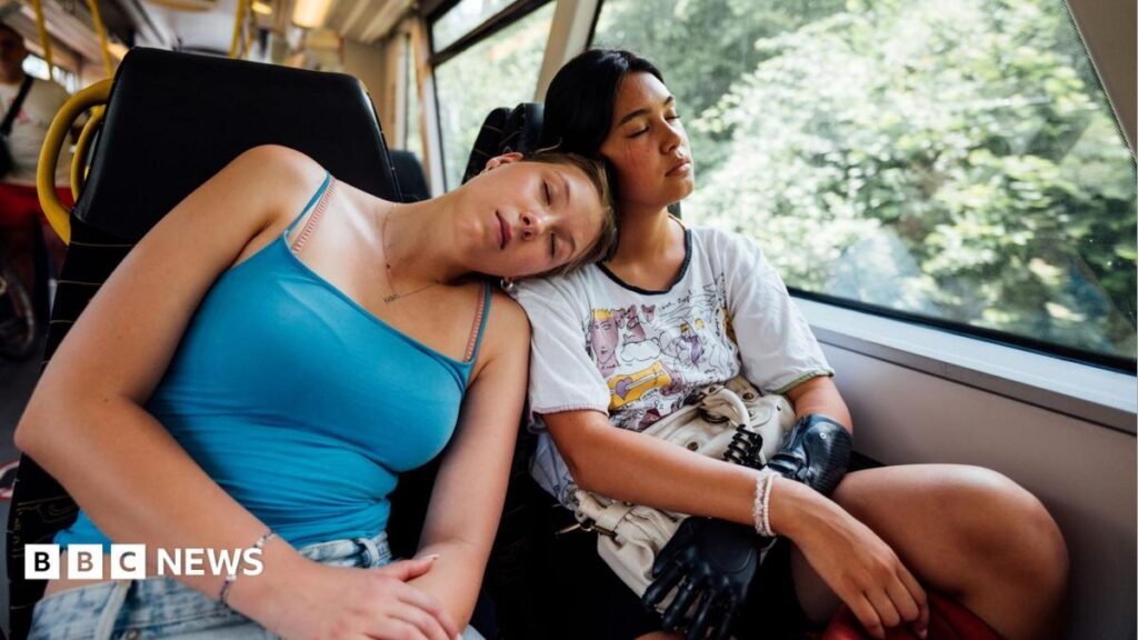 Sunshine to meal times: How to beat jet lag Two young women asleep on a train - one wearing a blue vest top leans on the other's shoulder