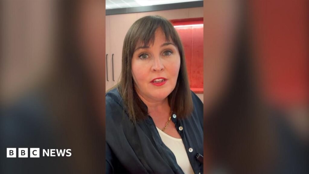'Young people are not snowflakes' new report finds A woman with long brown hair talks to the camera. She is wearing a white vest and navy overshirt.