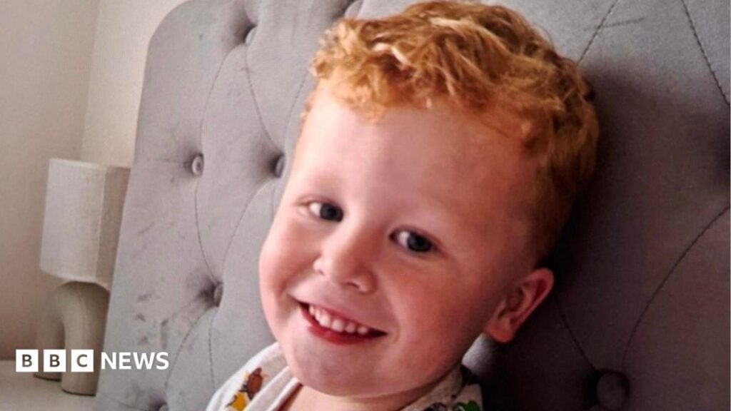 Suffolk and Essex NHS remove 10 staff over Noah Woods data breach Three-year-old Noah Woods, with light hair and wearing a brightly coloured top, smiles at the camera.